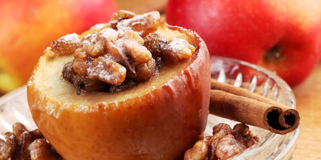 a baked apple stuffed with walnuts and raisins