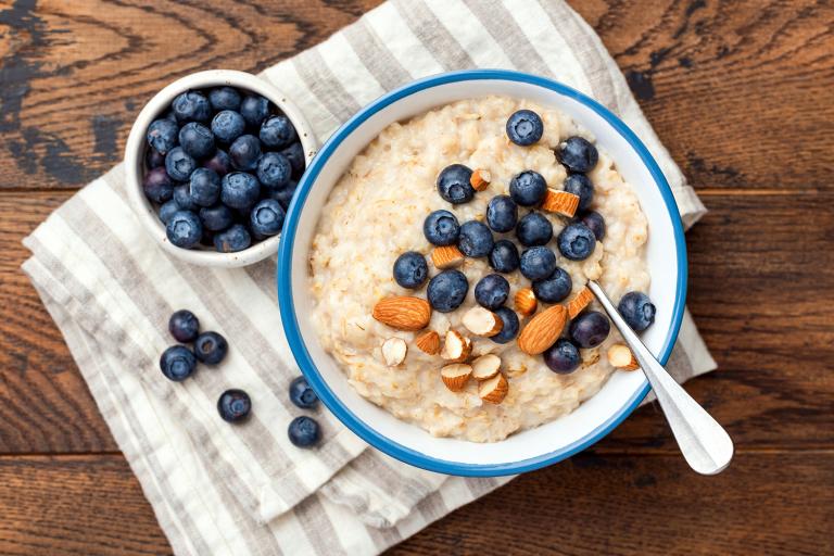 Blueberry-Almond Paleo Porridge a bowl of coconut porridge with almonds and blueberries