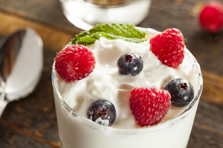 Fresh Berry Parfaits with Spiced Coconut Cream a close-up of a creamy parfait topped with berries