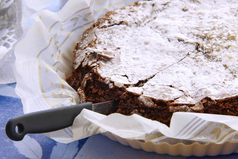 Gluten-Free Chocolate Cake a deep dark chocolate cake with confectioner's sugar on top