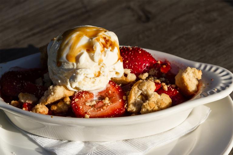 Gluten-Free Strawberry-Rhubarb Crisp a dish of strawberry-rhubarb crisp topped with ice cream