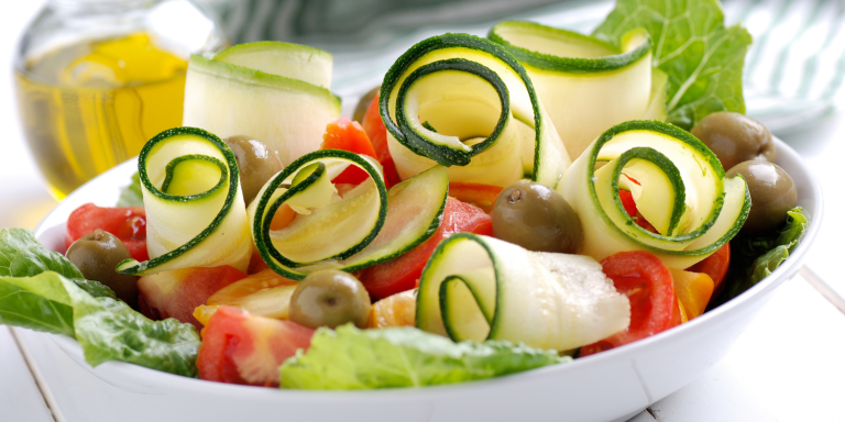 Tomato & Zucchini Salad with Spicy Garlic Vinaigrette A bowl of crisp, fresh salad