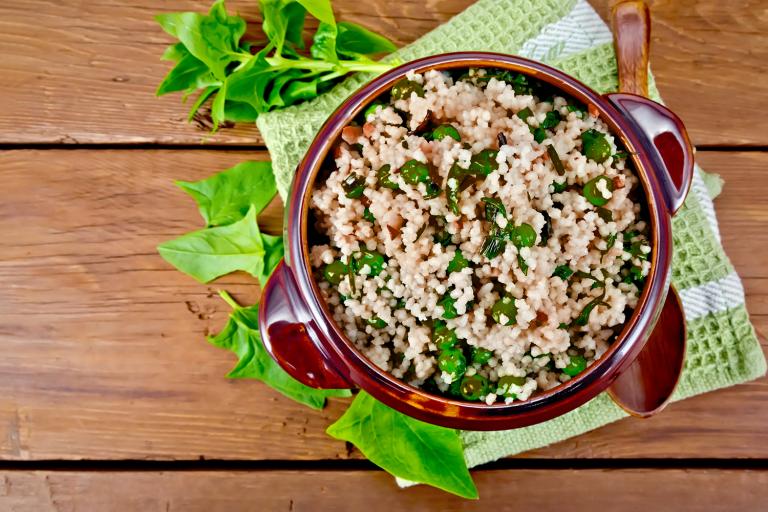 Quinoa Bowls with Avocado Dressing a bowl of quinoa and spinach