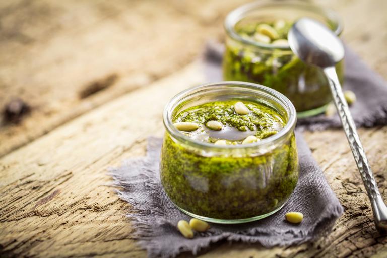 Tomatillo-Sunflower Salsa Verde Tomatillo-Sunflower Salsa Verde in glass jars on a rustic wooden table.