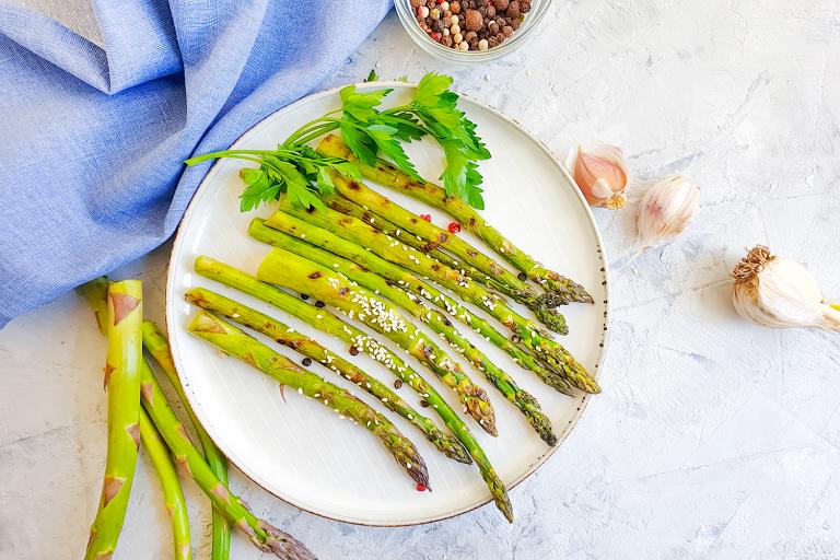 Roasted Asparagus with Garlic a plate of asparagus with garlic